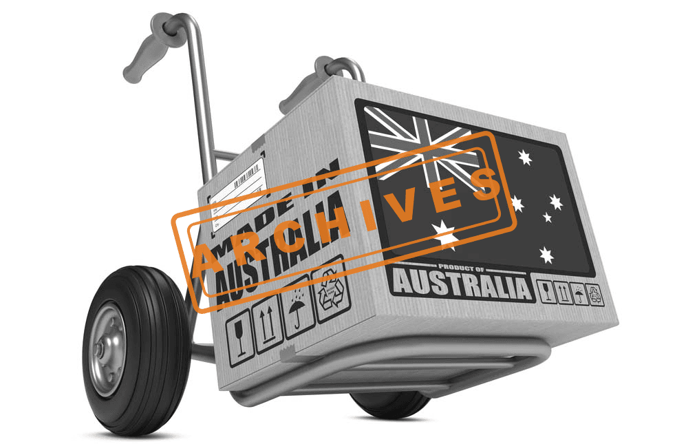 Hand truck carrying a boxy crate labeled with Australian flag and symbols, representing exports and global trade.